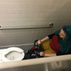 Jill Pantozzi in the “technically ADA compliant” bathroom stall on the 28th floor of her office, unable to maneuver her scooter in any way.
